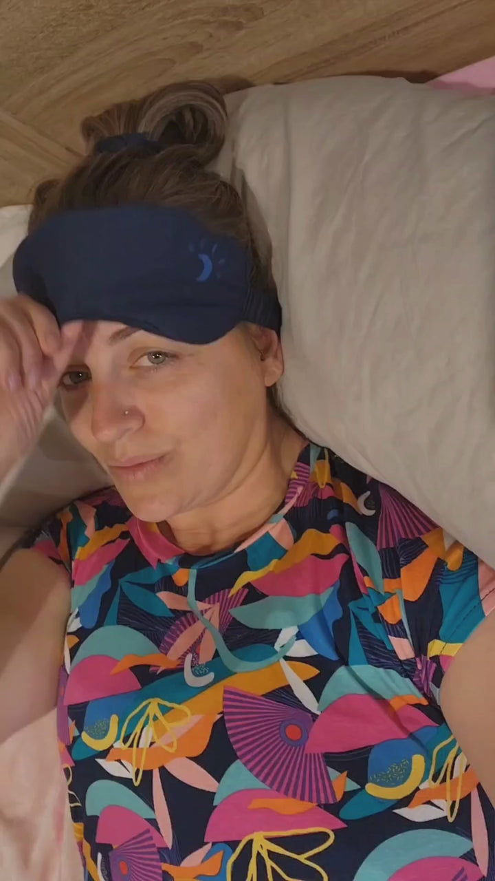 Model wearing a Kip & Boo bamboo sleeping eye mask, highlighting the comfort and eco-friendly design of women's sleepwear accessories in Australia. Navy Seminyak Style